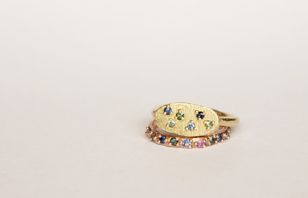 Gold ring band with sapphires