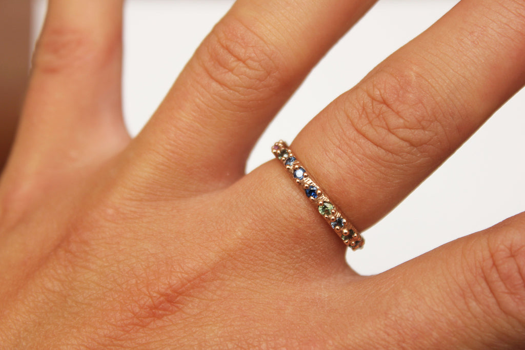 Gold ring band with sapphires